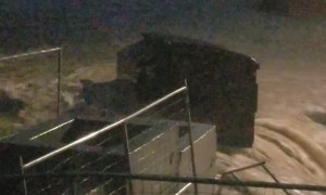 Floodwaters Wreak Havoc on Suburban Street