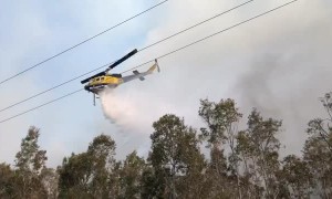 Helicopter Helps Extinguish Flames