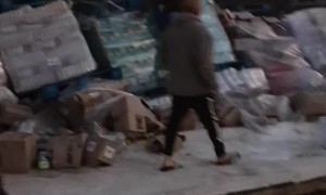 Crashed Truck's Cargo Gets Taken Away