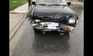 Truck Plows into Parked Car