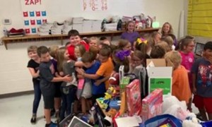 Kid who lost everything in house fire surprised with toys from students