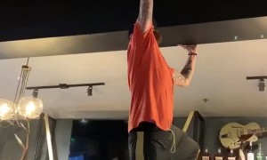 Manager Attempts to Remove Sticky Bra from Ceiling