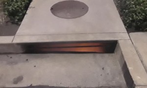 Smoke Spews from Flaming Sewers