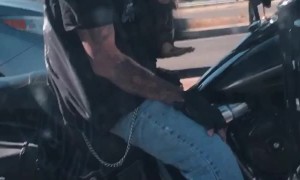 Scary Biker Carries Cute Puppy