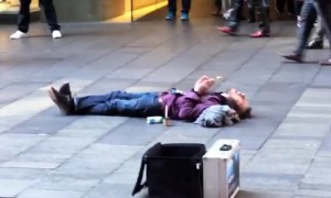 Beatboxing Busker Performs for Supine Spectator