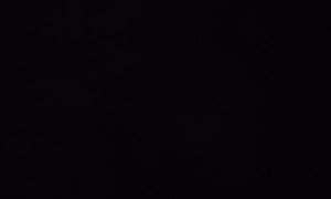 Snowmobile Rolls Back on Rider