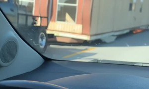 Sparks Fly as Man Moves Trailer with No Wheels