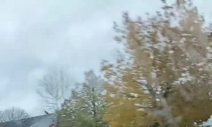 Truck Equipped with Train Horn Makes Car Stop at Tracks