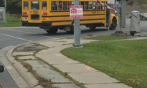 School Bus Comes Uncomfortably Close to Train