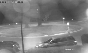 Fleeing Car Flies Over Roundabout