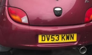 Car Launches into Wall Leaving Exhaust Shop