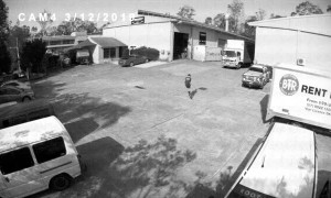 Scooter Rider Relaxes Under Reversing Truck