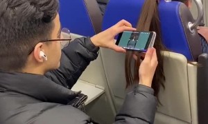 Passenger Hangs Phone From Hair