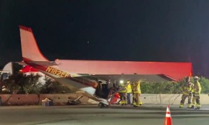 Cessna Parked on Busy Highway After Emergency Landing