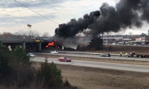 Truck Catches Fire after Colliding with Overpass
