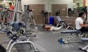 Dude works on his swimming strokes at the gym