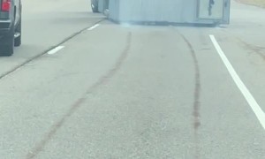 Truck Hauling a Smoking Structure