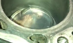Installing a Piston into an Engine with a Hammer