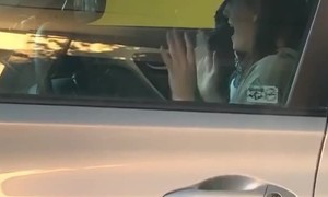 Woman Caught Excitedly Dancing in Car