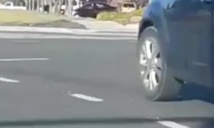 Strange Scenes as Man Hangs Onto Car Hood