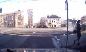 Colliding Cars Barely Miss Pedestrians