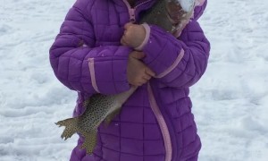 Daughter's First Fish Through the Ice