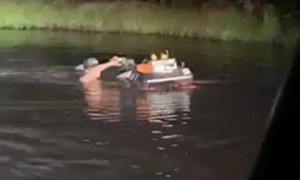 Guy Pushes Four-Wheeler Through the Pond