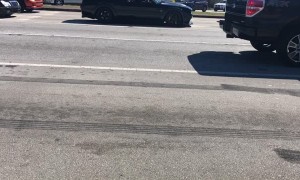 Muscle Car Loses a Tire in Streetlight Burnout