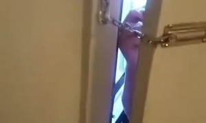 Girl Unlocks a Chain Door from the Outside