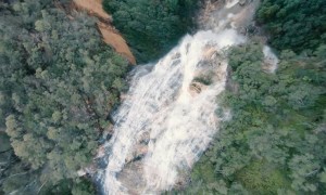 FPV Drone Zooms through Waterfall Dive