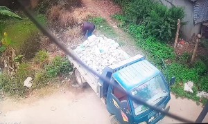 Truck Tumbles into a Pond