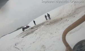 Men Work to Rescue Horses from Frozen Pond