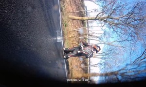 Slick Road Causes Rider to Slip