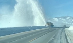Snow Removal Machine Sending Snow Skyward