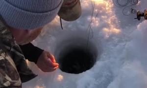 Man Makes Huge Catch while Ice Fishing