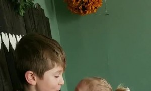 Older Brother Comforting Baby Sister