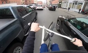 Cyclist Skillfully Weaves His Way through Traffic