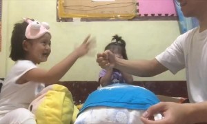 Daughters Play a Whimsical Game of Rock, Paper, Scissors With their Father