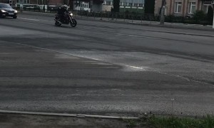 Policeman Attempts to Take Down Rider on Foot