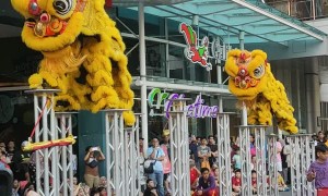 Stilt Dancers Wearing Dragon Costumes Celebrate the Coming of the Dry Season in Malaysia
