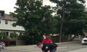 Super cool cop plays basketball with kids
