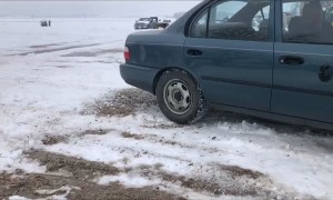 Car Modified With Wheels That Are Steel Gears