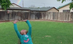 Kiddos Excited over Backyard Rainbow