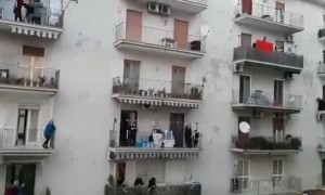 Dance party from the balconies of a neighborhood in Naples