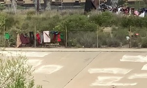 Train Packed With Tanks Rolls Along Tracks