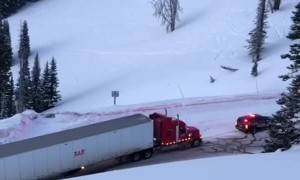 Police Car Pulls Truck Along Icy Road
