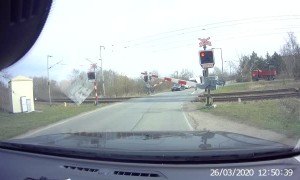 Impatient Bicycle Rider Almost Hit by Train
