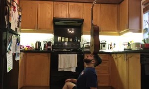 Guy Skillfully Balances Various Objects on His Head