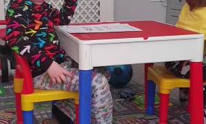 Siblings Tussle over Table