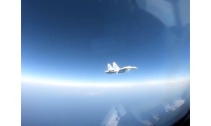 Video shows Russian jet flying within 25 feet of US spy plane